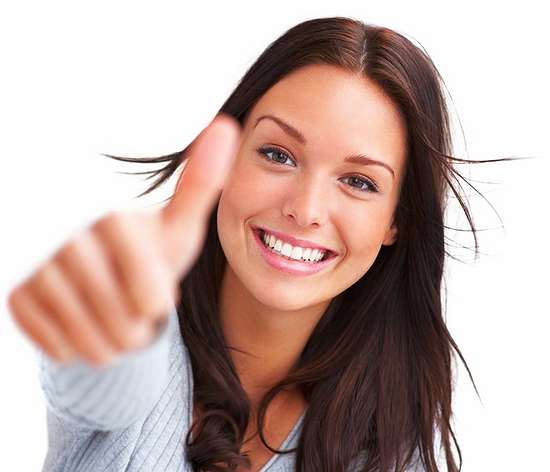 Portrait of attractive young female showing a thumbs up on white background